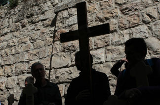 Christian pilgrims carry wooden crosses along the Via Dolorosa during the Good Friday procession in Jerusalem's old city in 2011.