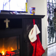 Tandra Dixon's two-year-old son, J.J., looks out the front door of their South Los Angeles home on Wednesday afternoon, Dec. 21, 2016. In November, Dixon and her five children moved into this two-bedroom apartment.