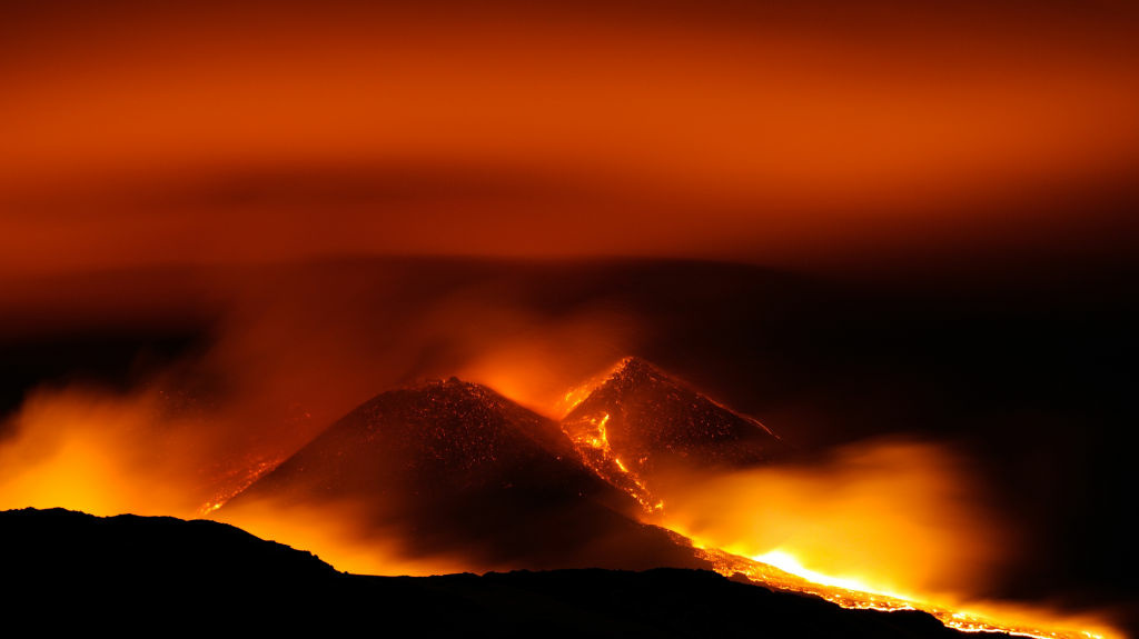 The sky glowed red above Sicily's Mount Etna early Wednesday.