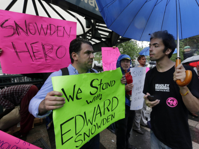 Demonstrators hold signs supporting Edward Snowden in New York's Union Square Park, on Monday. Snowden, who says he worked as a contractor at the National Security Agency and the CIA, gave classified documents to reporters, making public two sweeping U.S.