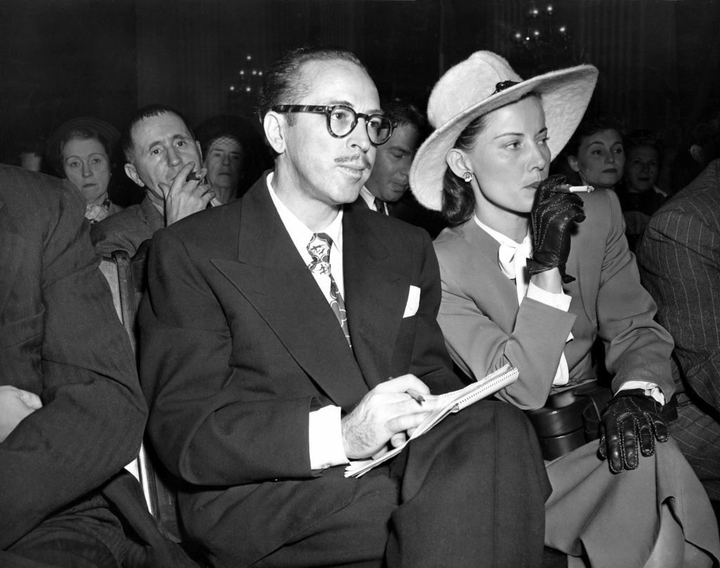 In this Oct. 28, 1947 file photo, screenwriter Dalton Trumbo, left, and his wife, Cleo, listen from the audience as the chairman of the House Un-American Activities Committee (HUAC) announces a contempt citation against Trumbo at a hearing in Washington, D.C.