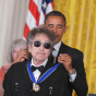 US President Barack Obama presents the P