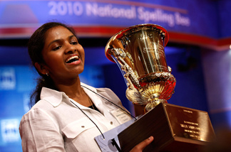 Fourteen-year-old Anamika Veeramani of Cleveland, Ohio, hoists her trophy after winning the Scripps National Spelling Bee June 4, 2010 in Washington, DC.
