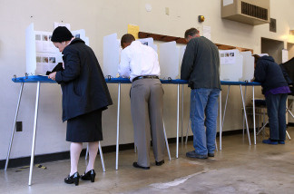 Voters fill out ballots at a polling place in a fire station on June 8, 2010 in Riverside, California.