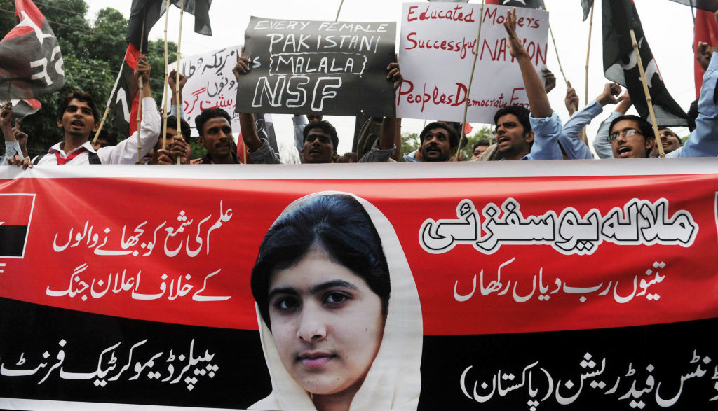 Pakistani youths shouts slogans during a protest against the assassination attempt by Taliban on child activist Malala Yousafzai in Lahore on October 15, 2012.