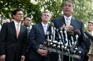 Speaker of the House John Boehner (R) speaks to the media following a meeting between US President Barack Obama and the House Republican Conference about the national debt limit.