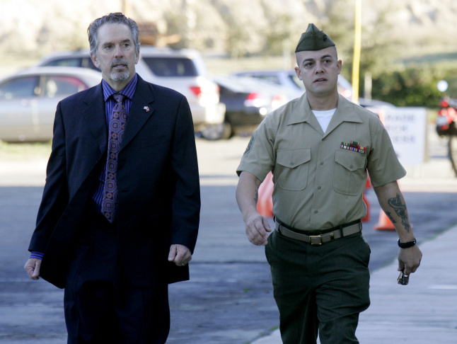 Staff Sgt. Frank Wuterich (R) walks into
