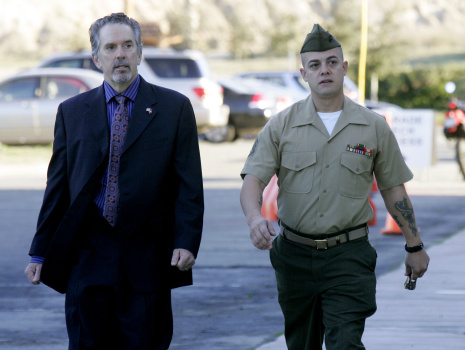 Staff Sgt. Frank Wuterich (R) walks into