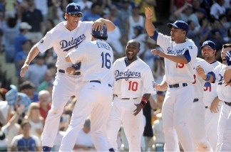 Clayton Kershaw and teammates of the Dodgers celebrate a two run homerun of Matt Kemp for a 2-1 win over the St Louis Cardinals at Dodger Stadium on April 17, 2011.