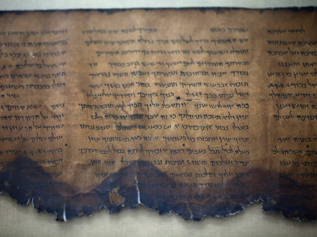 A fragment of the 2,000-year-old Dead Sea Scrolls is laid out at a laboratory in Jerusalem. More than 60 years after their discovery, 5,000 images of the ancient scrolls are now online.