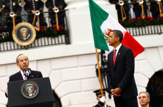 U.S. President Barack Obama (R) listens to Mexican President Felipe Calderon during a welcoming ceremony on the South Lawn of the White House May 19, 2010 in Washington, DC.