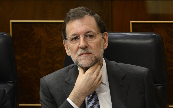 Spain's Prime Minister Mariano Rajoy ges