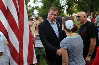 Conservative Republican candidate J.D. Hayworth, currently running against John McCain for the Republican nomination for Arizona's Senate seat, greets the crowd at a demonstration against illegal immigration on July 31, 2010 in Phoenix, Arizona.