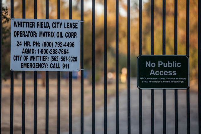 A sign notes the relationship the city of Whittier has developed with Matrix Oil to develop oil drilling in the Puente Hills.