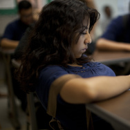 Jackueline Arreola, 16, reads YA novel, "A Fault in Our Stars," one of 80,000 titles available on her tablet.