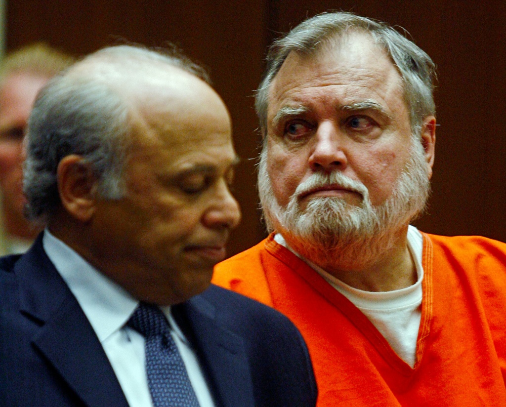 Michael Stephen Baker, right, a former Catholic priest accused of molesting a number of boys over the past 20 years pleads guilty to sexually abusing two boys listens to his victim's testimony Monday, Dec. 3, 2007, after being sentenced to 10 years in prison during a court appearance in Los Angeles Superior Court. At left is his attorney, Leonard Levine.