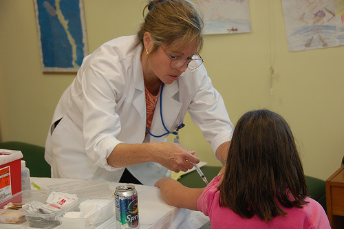 A doctor administers a shot to a young girl. A new tuberculosis vaccine failed in its efficacy trial, with only a 17 percent effectiveness rate. It was the first trial of a TB vaccine since 1921.