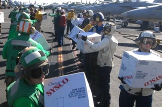 Sailors assigned to the aircraft carrier USS Ronald Reagan prepare 4,500 pounds of supplies on Nov. 9, 2010, to be delivered to the Carnival Splendor, which lost power and became stranded early Monday after a fire in the engine room. The aircraft carrier was diverted from its current training maneuvers to help out the cruise ship which was on its way to the Mexican Riviera.