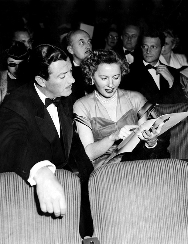 Barbara Stanwyck with husband Robert Taylor at the 21st Academy Awards, held at the Academy Theater in Hollywood. Stanwyck was nominated for the "Best Actress" award for her portrayal of Leona Stevenson in the film, "Sorry, Wrong Number," but she lost to Jane Wyman. Photograph March 25, 1949.
