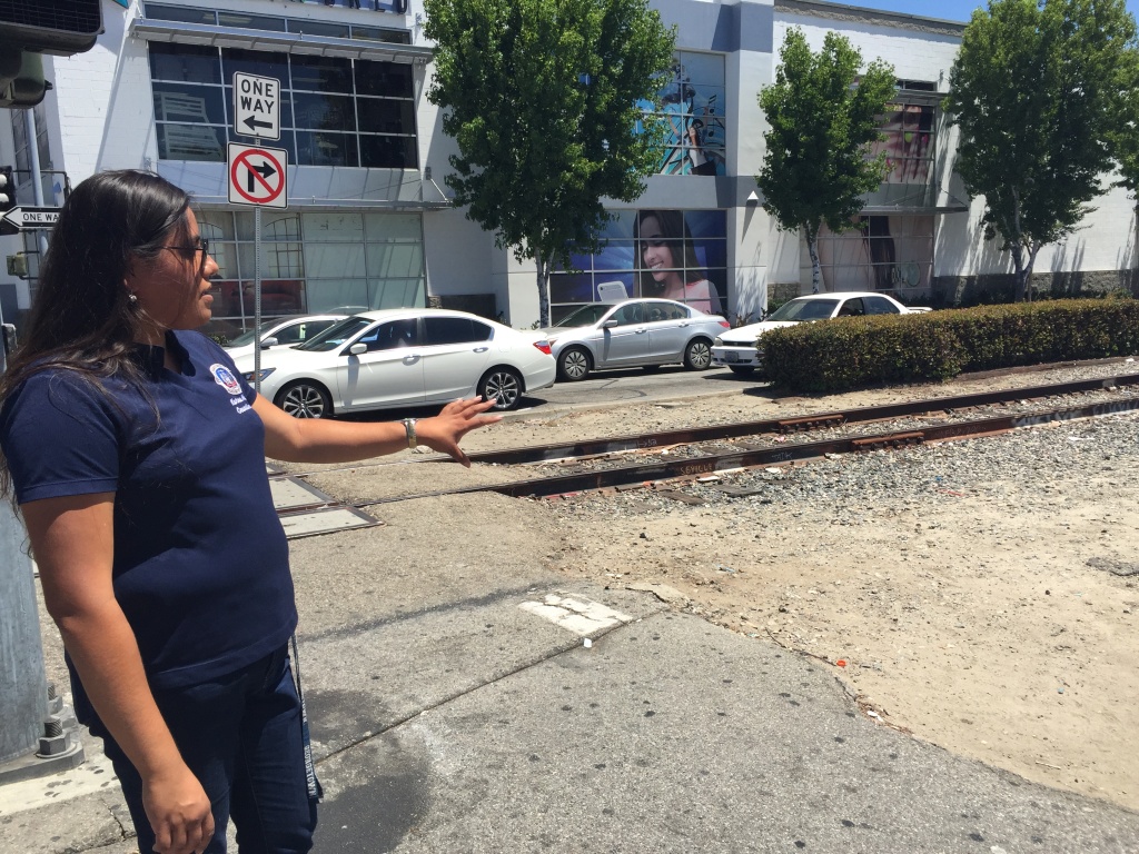 Huntington Park City Councilwoman Karina Macias points out the future site of a light rail station. Under Metro's ballot measure proposal, it would not be completed for at least 25 years.