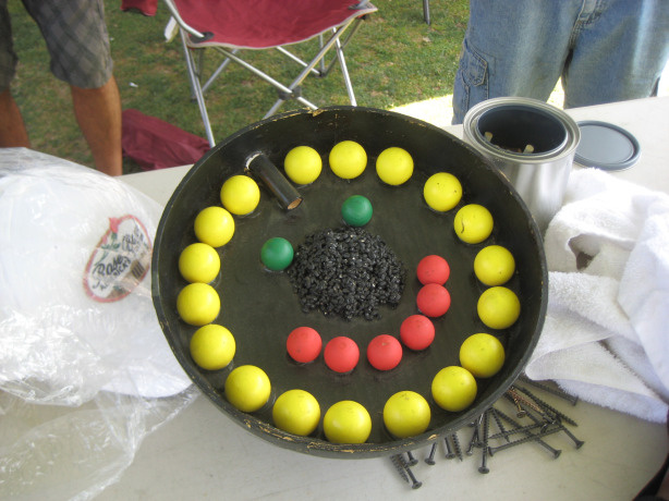 The inside of an airborne firework that creates a smiley face when it explodes.