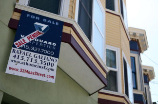 A sale pending sign is posted in front of a home for in San Francisco, California. Freddie Mac said Thursday the average U.S. rate on the 30-year fixed mortgage rose this week to its highest level in seven months but remains near historic lows. Low mortgage rates have helped support the gradually recovering housing market.