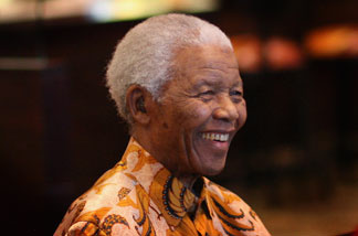 Nelson Mandela smiles during a lunch to Benefit the Mandela Children's Foundation as part of the celebrations of the opening of the new One&Only Cape Town resort on April 3, 2009 in Cape Town, South Africa.