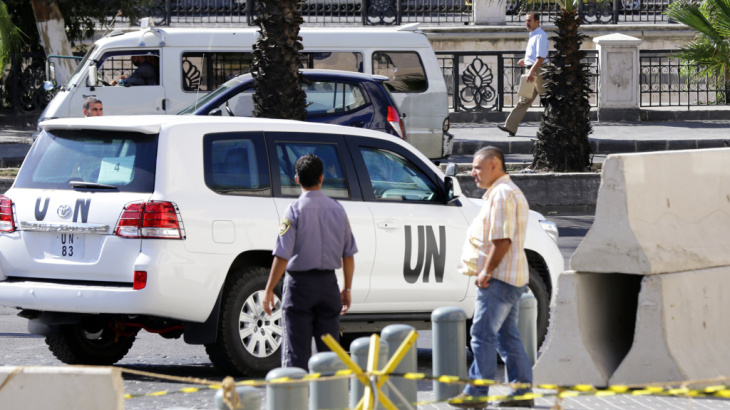 United Nations vehicles leave a Damascus hotel last week. The team of international disarmament experts began to dismantle Syria's chemical weapons production facilities on Sunday.