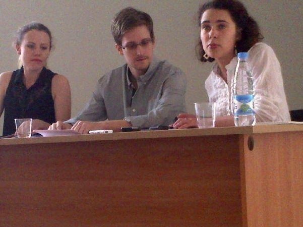 Edward Snowden has chosen where to live in Russia, which granted him asylum Thursday, his lawyer said. Here, Snowden is seen at Moscow's Sheremetyevo airport on July 12. At left is WikiLeaks' Sarah Harrison.