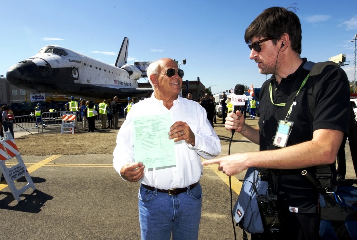 Steve Soboroff shows John Rabe the bill of sale for Shuttle Endeavour 11-12-12