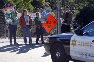 Protesters, left to right, Jennifer MacDonald, Kim Kelley, Laurie Gould and David Czamanske demonstrate on Jan. 12, 2011 in Arcadia to save 11 acres of old oaks and sycamore trees that Los Angeles County officials say must be cleared away so that sediment dredged from behind a dam can be dumped there.