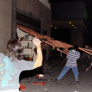 Rioters destroy an iron gate from a store in downt