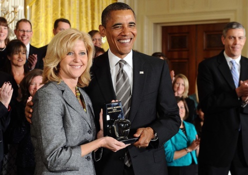 US President Barack Obama (C) gives the