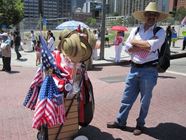 American flags and wide-brimmed hats for sale at a May Day immigrant rights rally in downtown L.A., May 1, 2011