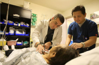 A doctor and an emergency room nurse care for a patient in the ER of Mission Community Hospital on January 28, 2009 in Panorama City, California.