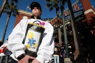 Laurie Condren of San Jose holds a collection bucket for Giants fan Bryan Stow the week after his attack on April 11, 2011 in Los Angeles.