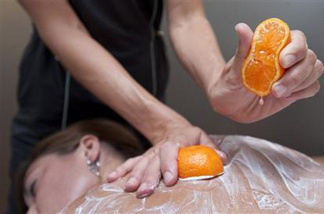 Body technician Bree Sarver demonstrates the pixie tangerine and pomegranate treatment on Andrea Olsonat the Ojai Valley Inn & Spa on Tuesday, Aug. 3, 2010 in Ojai, Calif.
