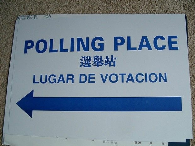 A multilingual sign points the way to a polling place, November 2006