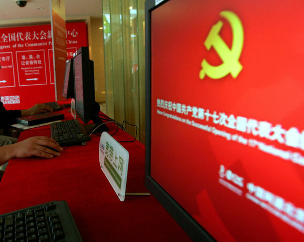 Staff members use computers at a press center in Beijing. Security experts say hacking of U.S. computers from China is becoming an increasing problem.