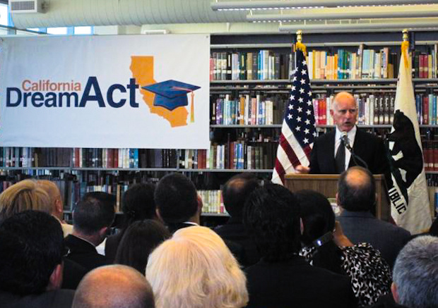 California Governor Jerry Brown speaks to a crowd before signing AB 130.