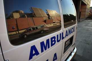 An ambulance transporting a patient is reflected in the window of another ambulance at Ronald Reagan UCLA Medical Center on October 9, 2008 in Los Angeles, California.