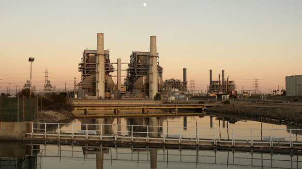 A new law in California, which goes into effect in Jan. 2013, will put a cap on the amount of greenhouse gases coming from vehicles and industry. Above, the Alamitos natural gas-fired power station in Long Beach, Calif.
