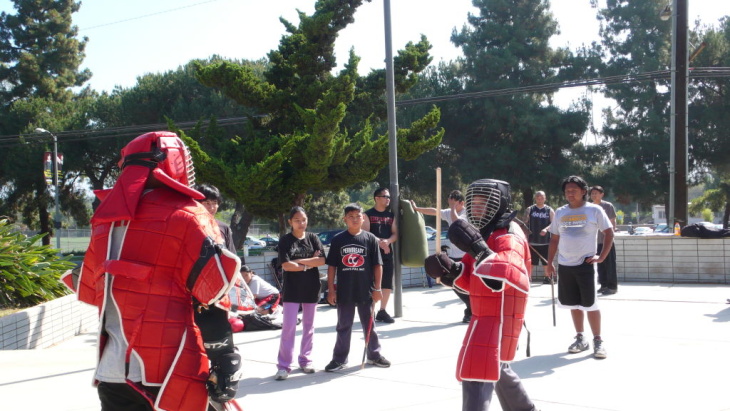 Reporter Jed Kim is about to get destroyed in an eskrima match