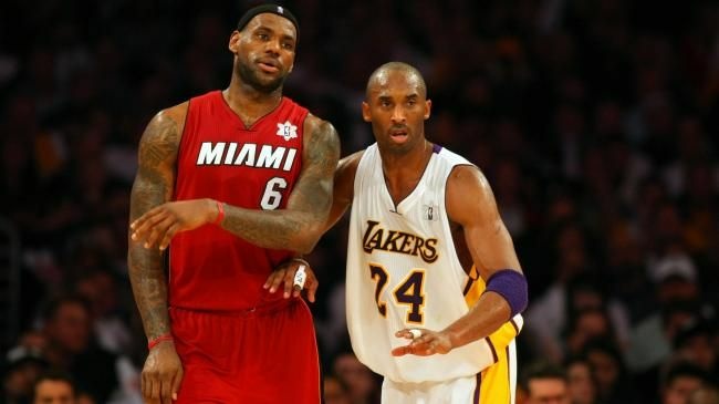Kobe Bryant #24 of the Los Angeles Lakers defends LeBron James #6 of the Miami Heat during the NBA game at Staples Center on December 25, 2010 in Los Angeles.
