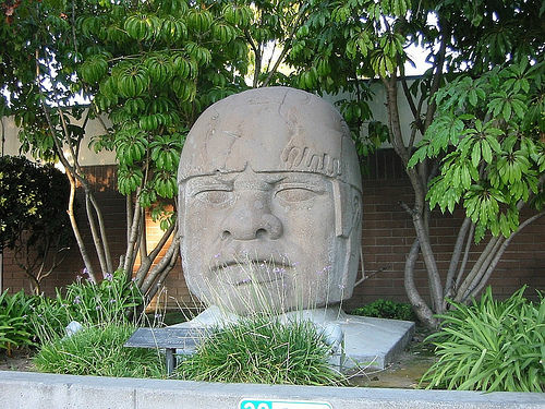 Covina's giant Olmec head once graced the city police station but now sits in a maintenance yard.