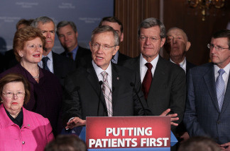 Flanked by Senate Democrats, Senate Majority Leader Harry Reid (D-NV) (C) speaks after a vote on health care on Capitol Hill on March 25, 2010 in Washington, DC. The Senate approved the health care bill with by a 56-43 margin and sent it to the House for a final vote.