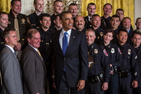 U.S. President Barack Obama poses for a picture with the 2013 National Association of Police Organizations TOP COPS award winners during a ceremony honoring them at the White House on May 11, 2013 in Washington, DC. TOP COPS are nominated by their fellow officers for outstanding service above and beyond the call of duty.