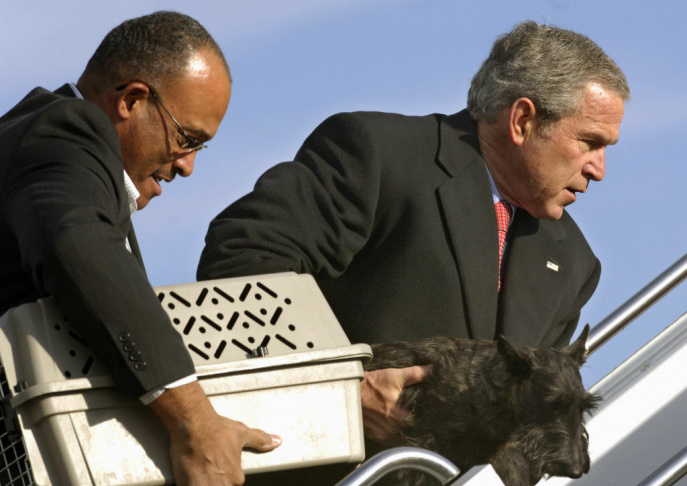US President George W. Bush carries Miss