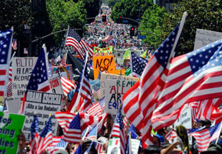 Thousands of demonstrators march during a May Day immigration rally on May 1, 2010 in Los Angeles, California. More than 100,000 people were expected to march from four directions towards Los Angeles City Hall to protest Arizona's new immigration law.