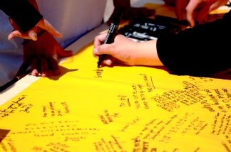 UC Riverside students and staff sign memorial banner for the campus community at their sister city, Tohoku University in Sendai, Japan.